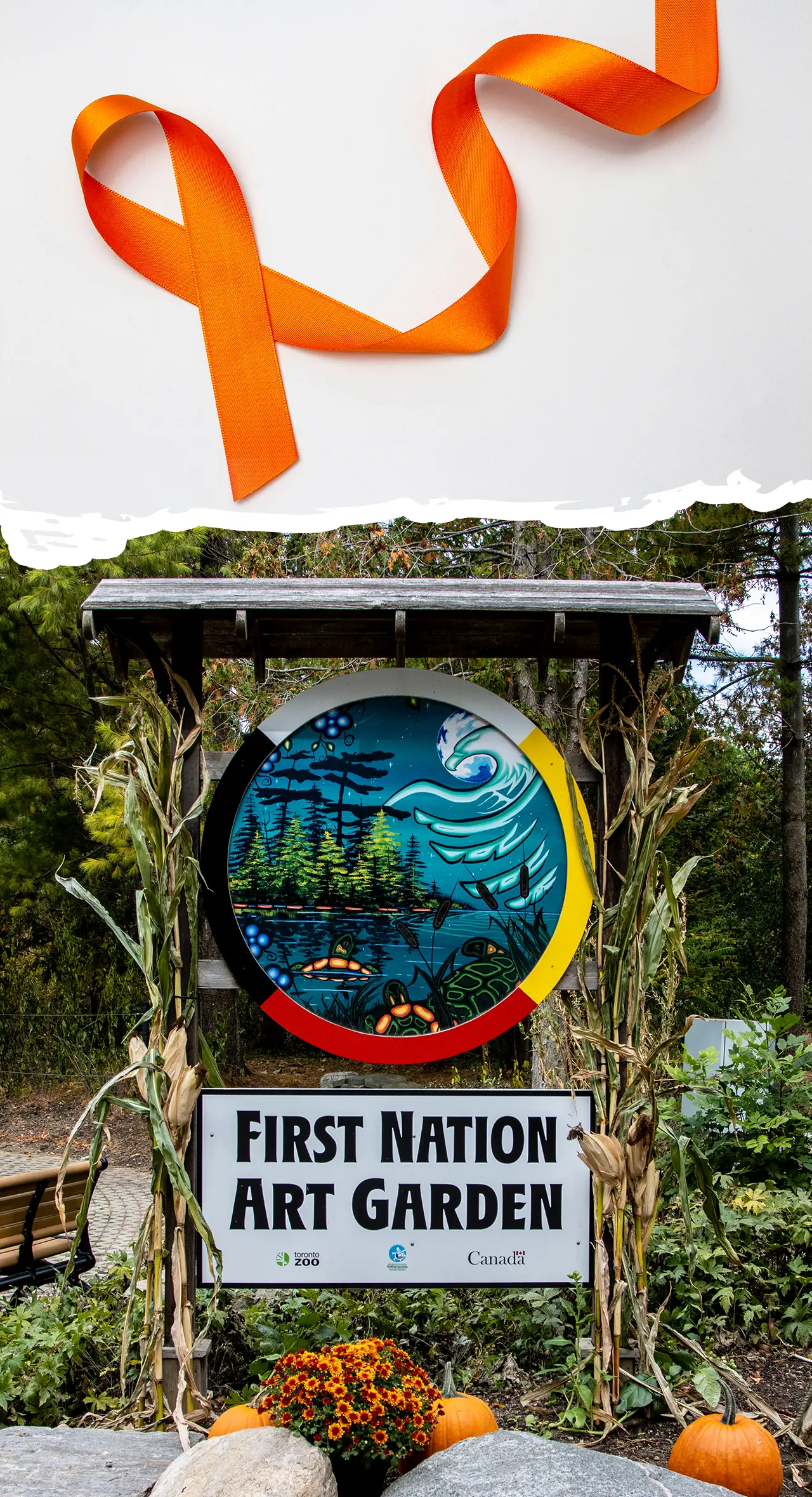 First Nation Art Garden sign with a painting at the Toronto Zoo, topped with an Orange Ribbon
