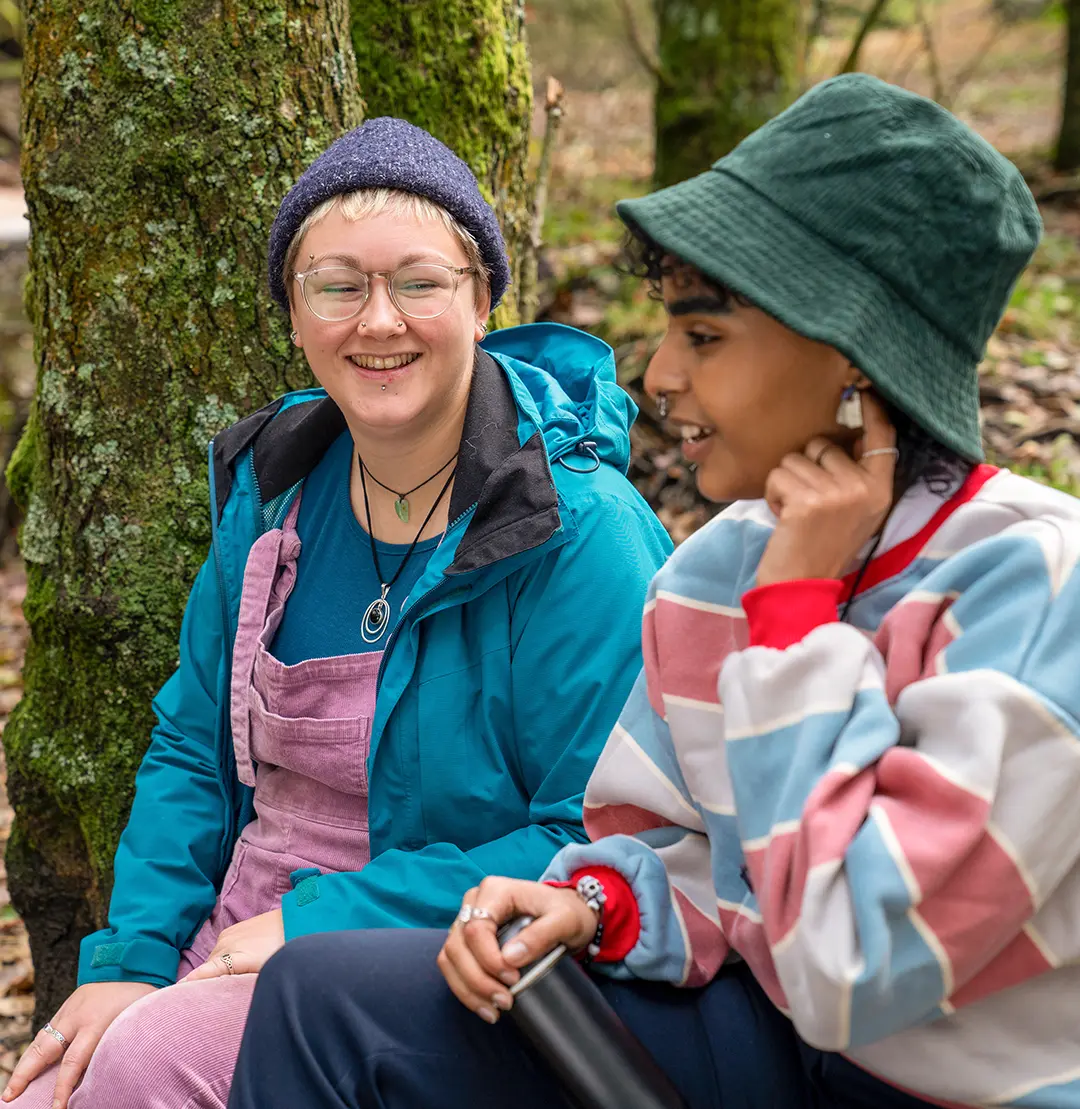 Woman and Child holding hands walking at the Zoo