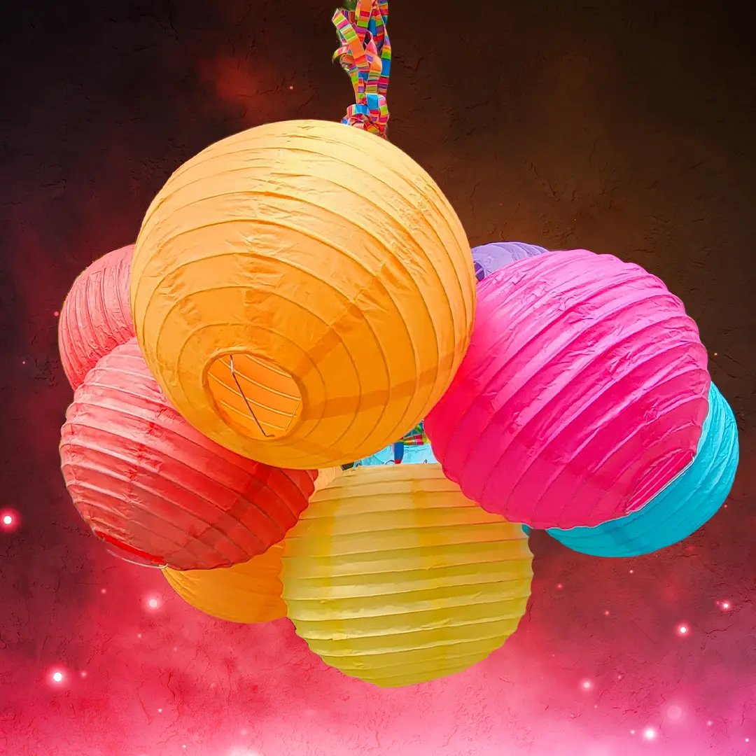 A bundle of lanterns in front of green leaves