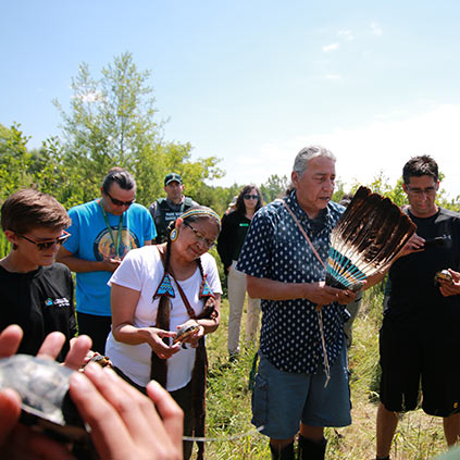 Group releaseing endangered blandings Turtles into the Rouge valley system