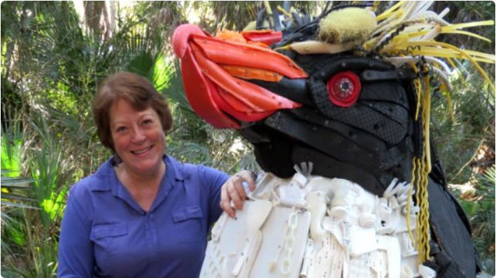 Angela Haseltine Pozzi, standing beside her sculpture Gertrude at the Toronto Zoo